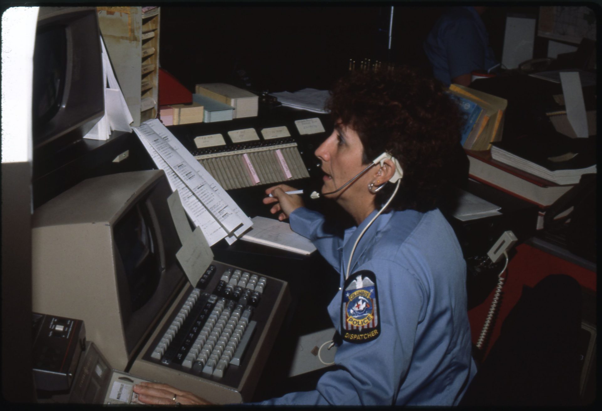 Columbus Police dispatcher working at a communications console