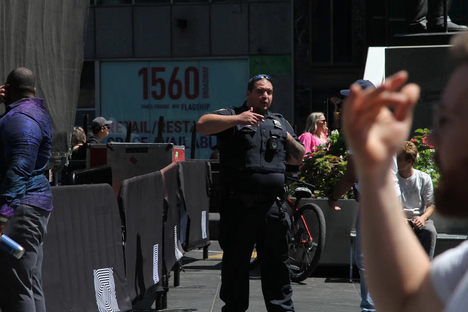 NYPD officer speaking with people at a public event in New York City