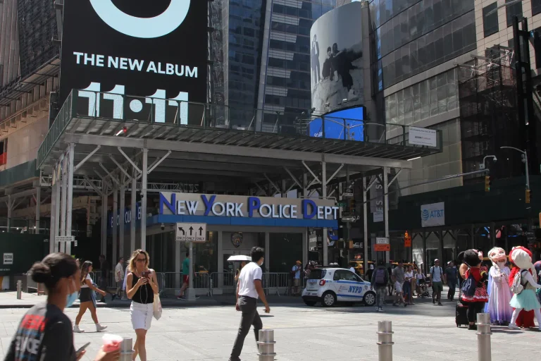Marked NYPD patrol car outside a police station in Times Square