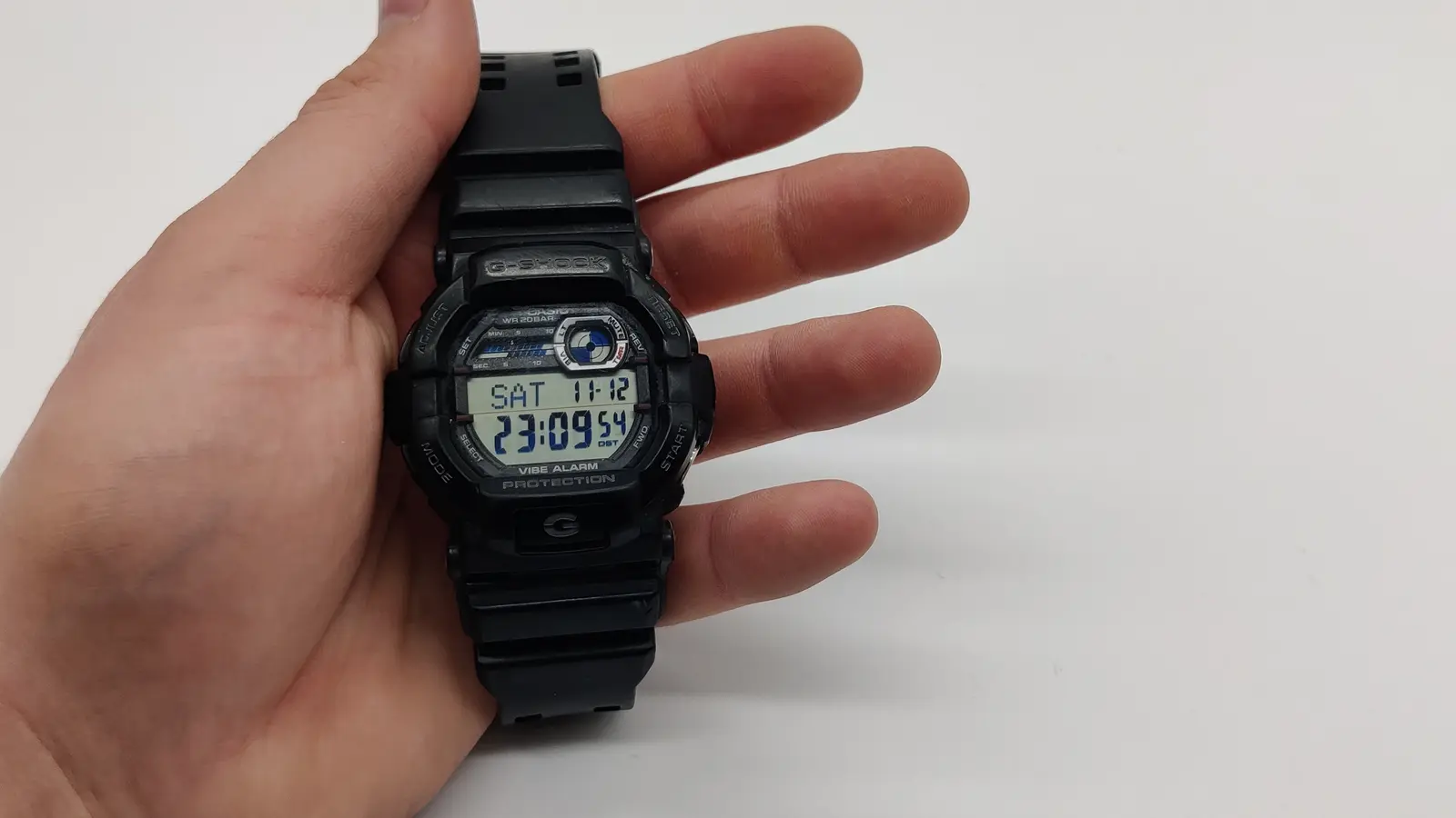 Black Casio G-Shock digital duty watch held in one hand