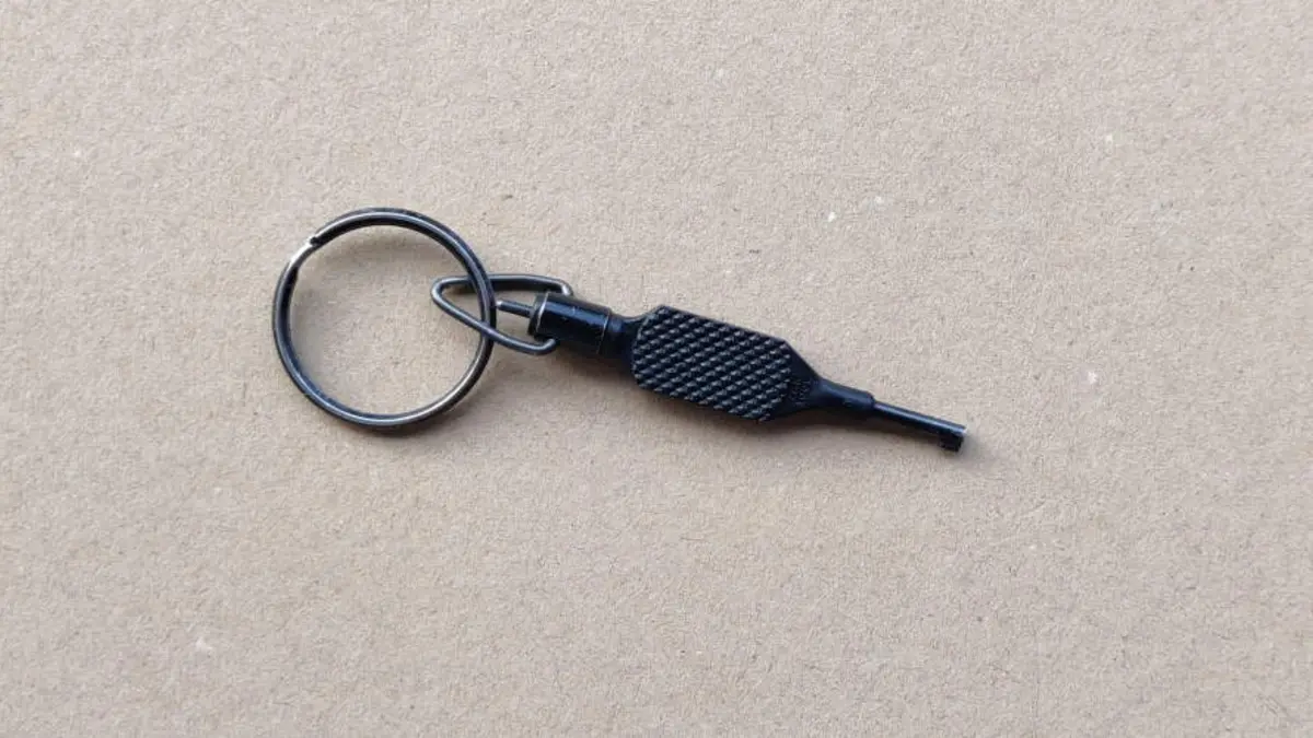Black Zak Tool swivel handcuff key with a textured grip
